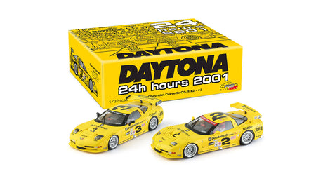 Two yellow Corvette C5-R race cars featured in a twin pack of 1/32 scale slot cars, commemorating the Daytona 24 Hour race in 2001. The cars are displayed in front of the product packaging which prominently displays the Daytona 24 Hour 2001 branding.