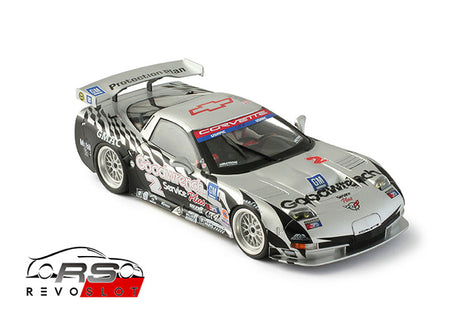 REVO Slot 0218 1/32 Corvette C5-R – Daytona 24 Hr 1999 #2 Slot Car, a detailed scale model of a racing Corvette with a striking, graphically-designed silver and black body.