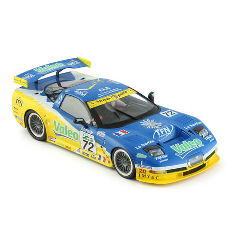 Detailed toy car model of a blue and yellow REVO Slot 0219 Corvette C5-R race car. The car features sponsor logos and branding, and appears to be from the 24 Hour Le Mans race in 2006, with car number 72.