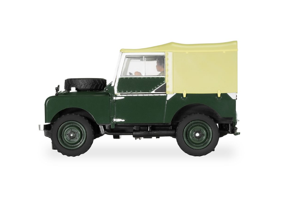 Classic green Land Rover Series 1 slot car model with retractable canvas top.