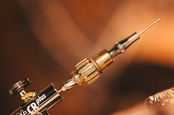 Sleek and precise Harder and Steenbeck 121231 Evolution 2024 CRPlus Solo Airbrush in golden hue, designed for professional-grade airbrushing.