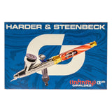 Dual-nozzle Harder & Steenbeck Infinity Giraldez airbrush on vibrant blue backdrop