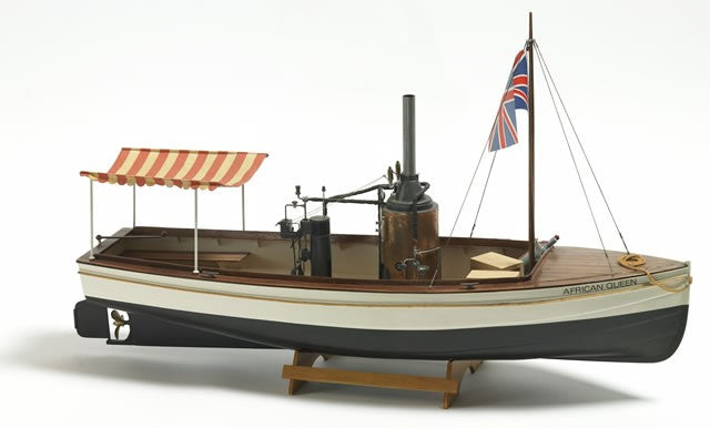 a model of a boat with a flag on it