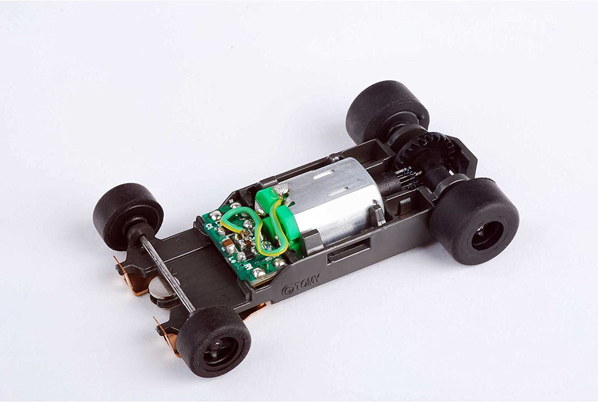 Sleek AFX 21023 Mega-G+ slot car with long 1.7-inch wheelbase and electronic components for optimized performance on the track.