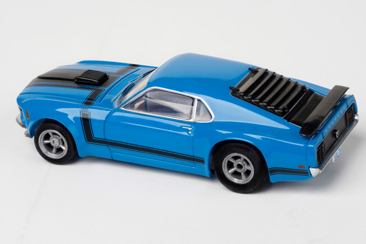 Glossy blue racing car with sleek design and black accents, the AFX 22026 Mega-G+ Mustang Clear Boss 302 Blue slot car.