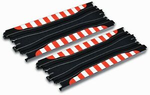 Flexible black and red striped slot car track sections, designed for customizable racing circuits.