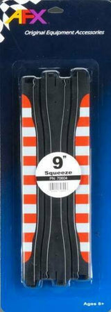Two vibrant red and white striped 9-inch slot car track pieces displayed on a black and white checkerboard packaging background.