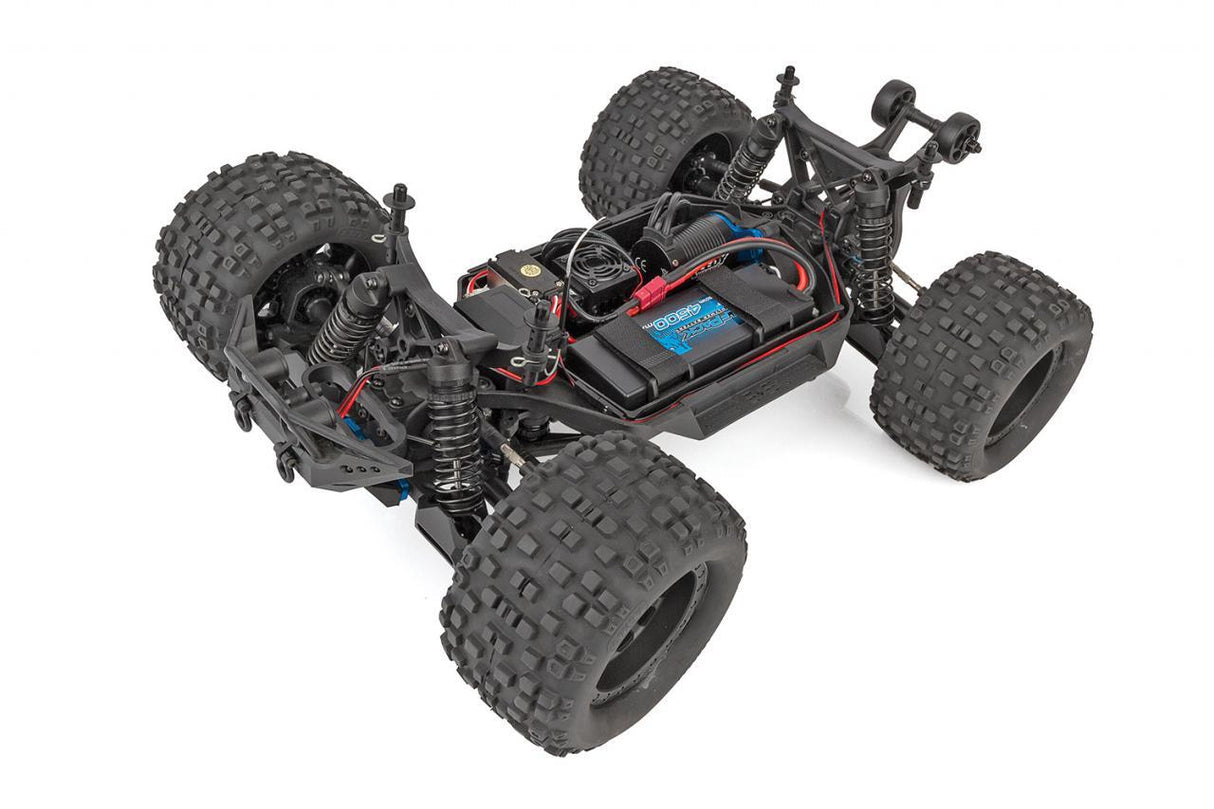 Rugged red Team Associated Rival MT10 monster truck with large off-road tires and detailed chassis on display.