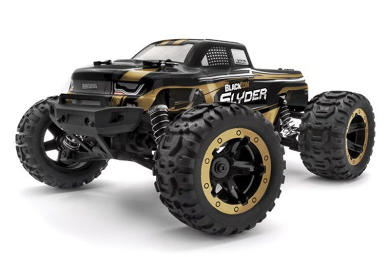 Rugged Blackzon Slyder MT 1/16 4WD electric monster truck in vibrant gold finish on display.
