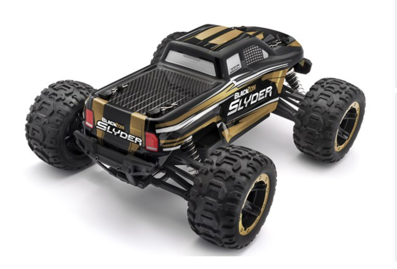 Powerful Blackzon Slyder MT 1/16 4WD electric monster truck in bold gold and black design, ready for high-speed off-road adventures.