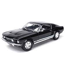 Sleek black 1967 Ford Mustang Fastback die-cast model, featuring detailed exterior and chrome accents.