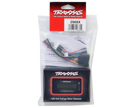Portable Traxxas iD LiPo Battery Voltage Checker/Balancer. Sleek black device with digital display, designed to monitor and balance lithium-polymer batteries for remote-controlled models.