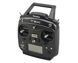 Compact black Futaba 6k FHSS Transmitter with R3006SB Rx, featuring a sleek design and various control knobs for precise radio control.