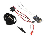 Futaba 6k FHSS Mode 2 transmitter with R3006SB receiver, wiring, and accessories on white background.