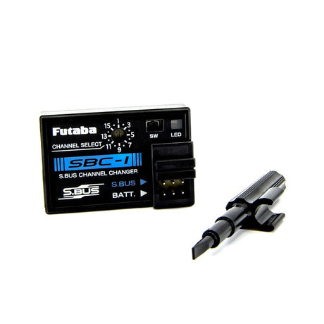 Compact Futaba SBC-1 S.Bus Channel Programmer device for radio control gear, with channel select buttons and LED indicator.