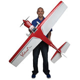 Sleek red and white RC plane model held by smiling man in casual outfit, showcasing the Valiant 10cc RC Plane ARF from Hangar 9.