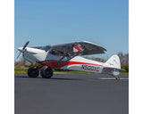 Sleek Hangar 9 Cub Crafters XCub 60cc ARF RC plane with distinctive red and white markings on the runway.