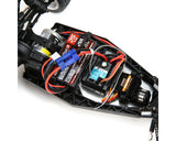 Compact 1/16 scale Losi Mini-B 2wd Buggy with exposed brushless motor, battery, and electronic components in a detailed black and red chassis design.
