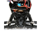 Compact remote-controlled Losi Mini-B 1/16 2wd buggy in yellow, with detailed chassis components and suspension system visible.